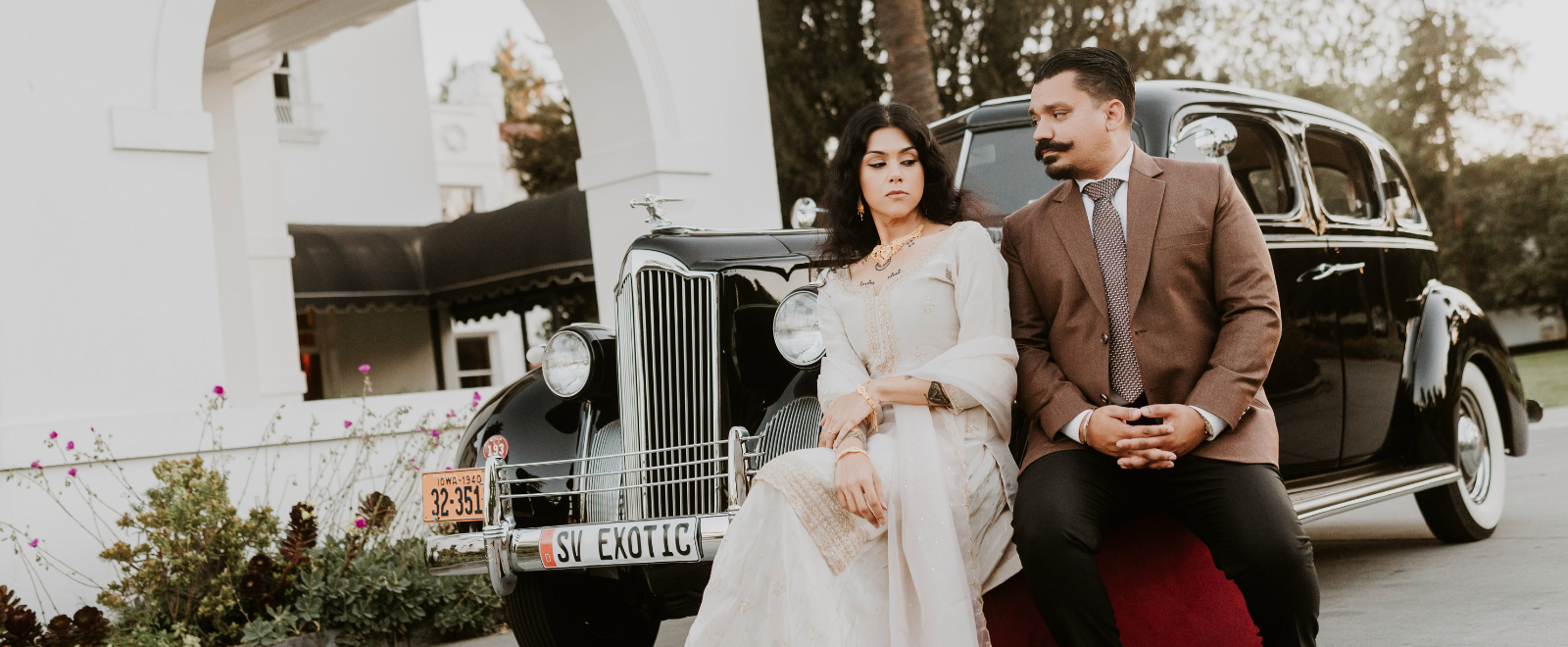 Angelica and Austin cinematic retro style engagement portrait at Hayes Mansion with moody lighting and romantic editorial composition