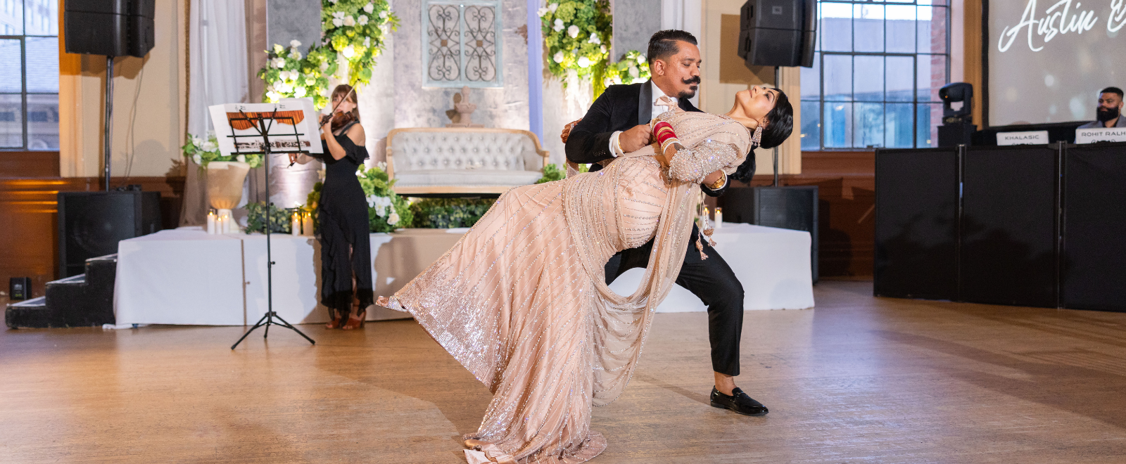 Romantic Indian wedding reception portrait of Anjelica and Austin during cinematic ballroom celebration