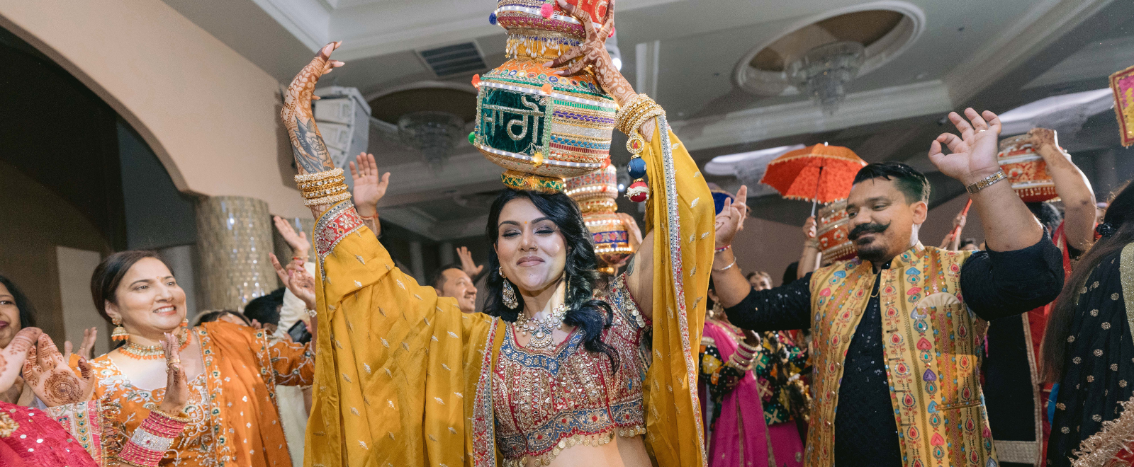Anjelica and Austin’s Punjabi Jaago ceremony at Grand Pavilion Banquet Hall with vibrant South Asian wedding decor and cinematic wedding photography