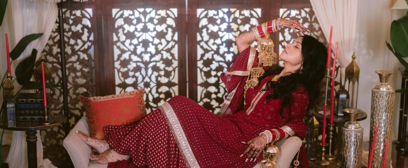 Anjelica bridal choora ceremony portrait with traditional Punjabi wedding jewelry and red bangles