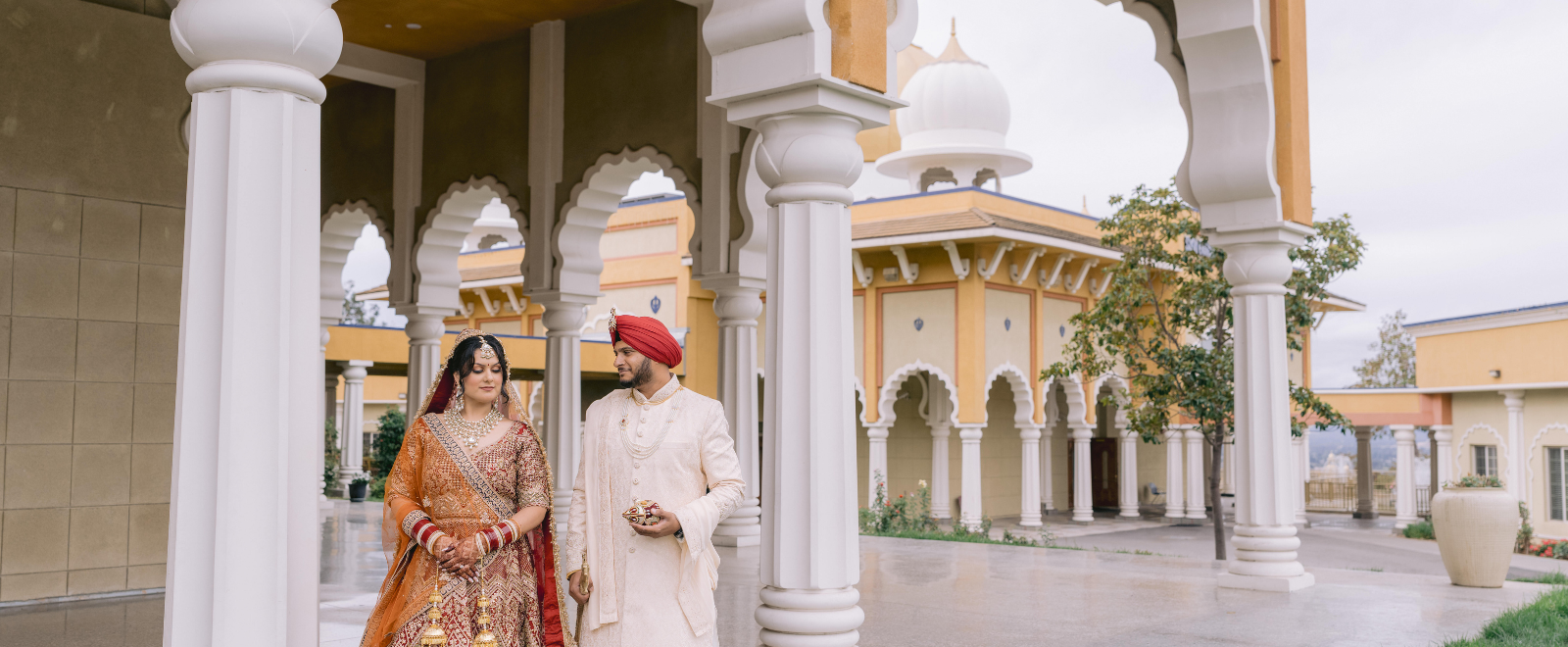 Punjabi bride and groom portrait outside San Jose Gurdwara during Sikh wedding ceremony